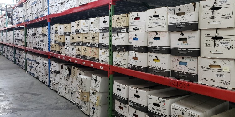 Picture of boxes of records in storage.